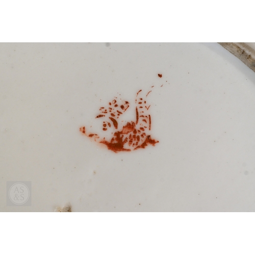 452 - An 18th century French Lille factory plate (ca 1790), painted with green and blue floral sprigs cent... 