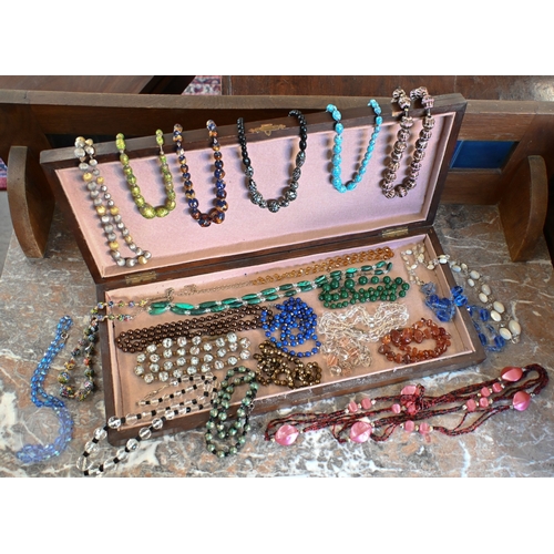 454 - A selection of twenty three glass bead, stone and other costume jewellery necklaces, contained in a ... 