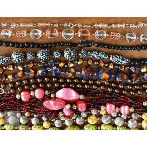 454 - A selection of twenty three glass bead, stone and other costume jewellery necklaces, contained in a ... 