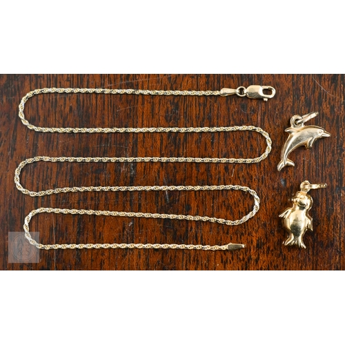 455 - A fine rope twist chain stamped 750, to/w two charms, also stamped 750 - dolphin and cartoon seal, 5... 