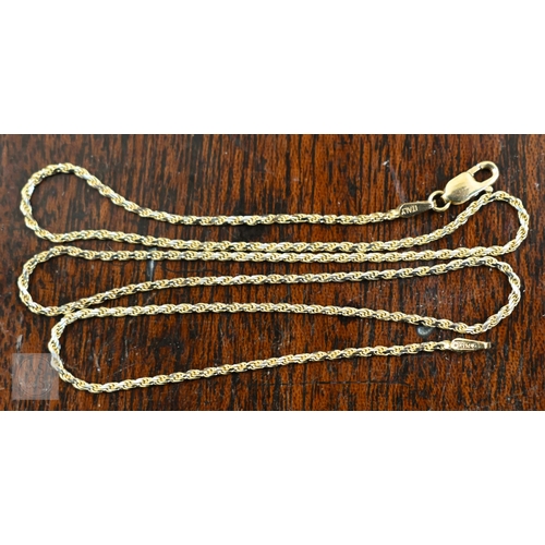 455 - A fine rope twist chain stamped 750, to/w two charms, also stamped 750 - dolphin and cartoon seal, 5... 