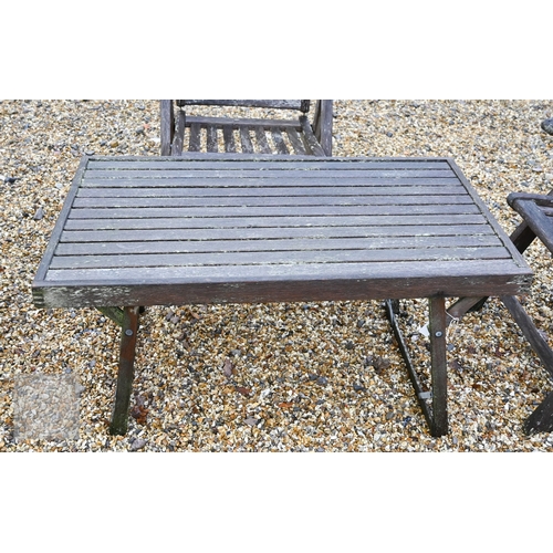 5 - Three weathered teak folding armchairs by Alexander Rose to/with a teak coffee table (4)