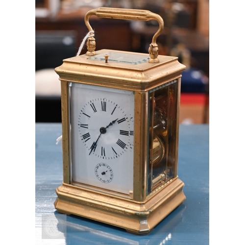 510 - An antique brass carriage clock with repeating movement striking on two bells with alarm function, 1... 