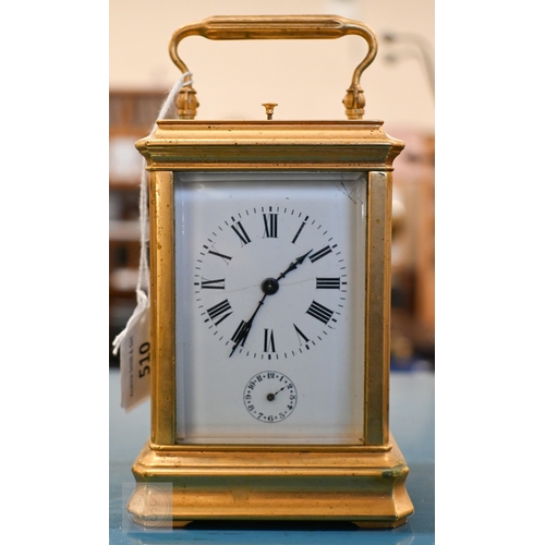 510 - An antique brass carriage clock with repeating movement striking on two bells with alarm function, 1... 