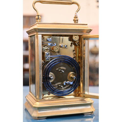 510 - An antique brass carriage clock with repeating movement striking on two bells with alarm function, 1... 