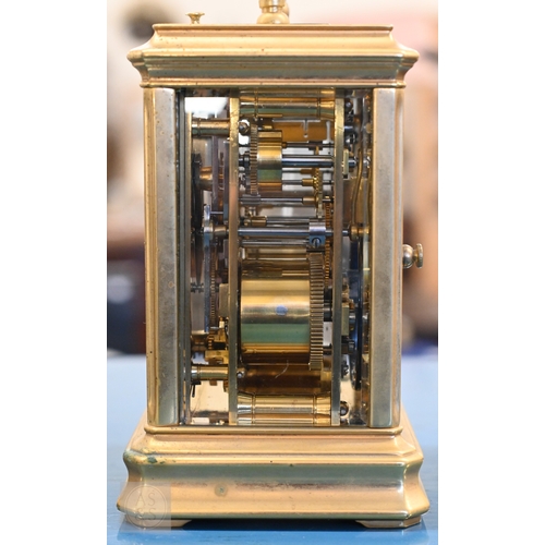 510 - An antique brass carriage clock with repeating movement striking on two bells with alarm function, 1... 