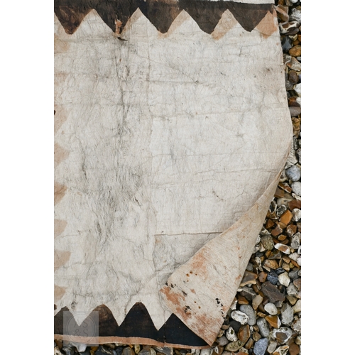 528 - An African carved wood stool with geometric patterned decoration, 39 x 53 cm, to/w a painted fibre p... 