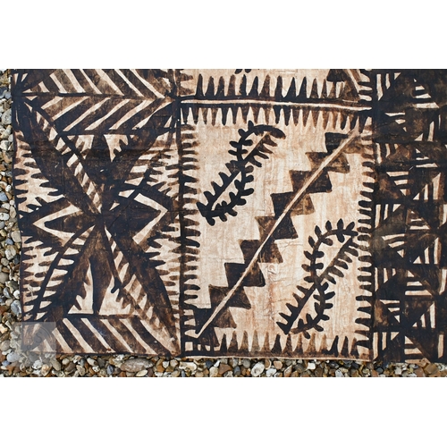 528 - An African carved wood stool with geometric patterned decoration, 39 x 53 cm, to/w a painted fibre p... 