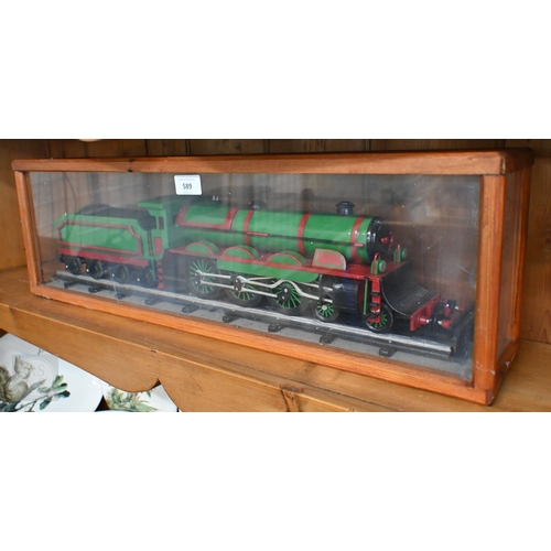 589 - A painted wood model train in glazed case, 67 cm long o/a