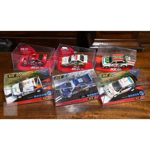 Six boxed SCX Racing System model rally cars