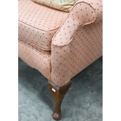 72 - A Georgian style walnut framed hump-back armchair upholstered in diamond/lattice pink fabric, with c... 