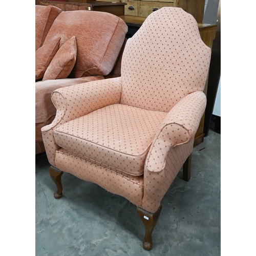 72 - A Georgian style walnut framed hump-back armchair upholstered in diamond/lattice pink fabric, with c... 