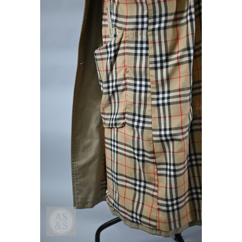 541 - Burberry's - A classic vintage men's double-breasted trench coat/mac with iconic checked lining, bel... 