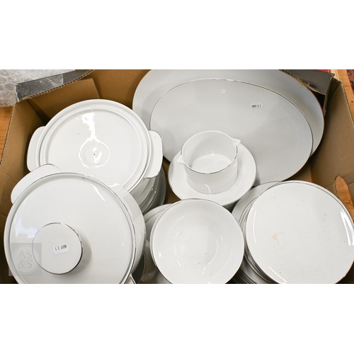 450 - A Thomas (Germany) white-glazed dinner service with silvered rims (box)