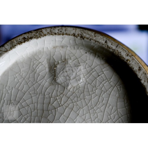 449 - A Japanese Meiji era pottery vase, relief-moulded with a carp leaping from a painted pond, with gild... 