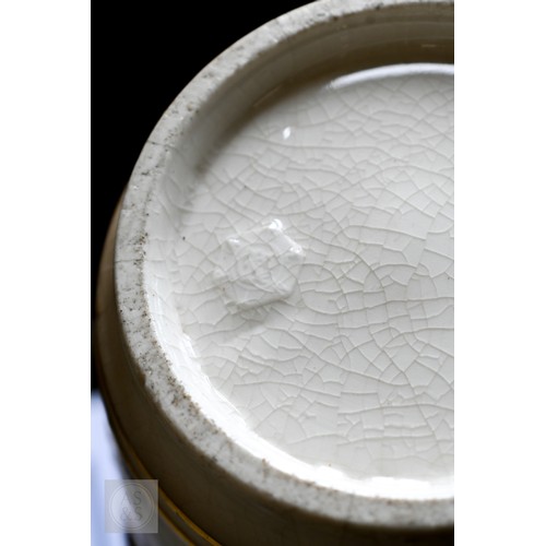 449 - A Japanese Meiji era pottery vase, relief-moulded with a carp leaping from a painted pond, with gild... 