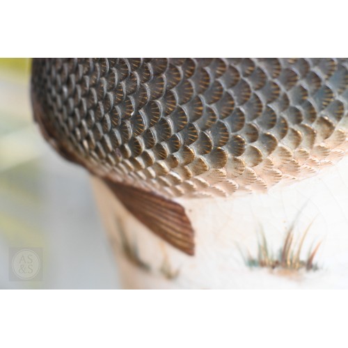 449 - A Japanese Meiji era pottery vase, relief-moulded with a carp leaping from a painted pond, with gild... 