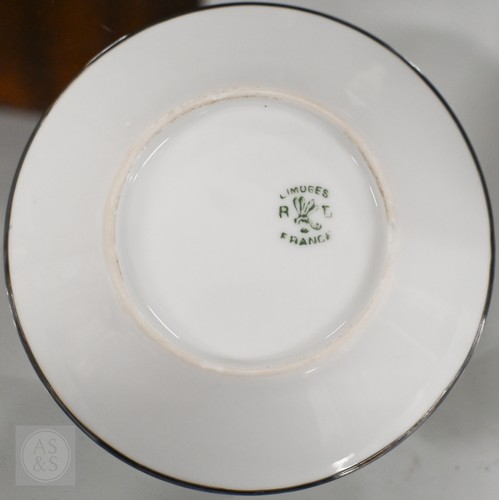 435 - A cased set of six Limoges coffee cans and saucers with silver overlays and a cased set of six Copel... 