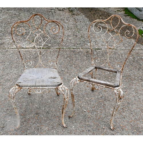 6 - A set of six weathered antique French wrought iron terrace chairs, with remnants of the original tim... 