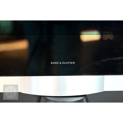 30 - A Bang & Olufsen Beovision 7 TV, 40 inch screen mounted to a B&O motorised stand, with power... 