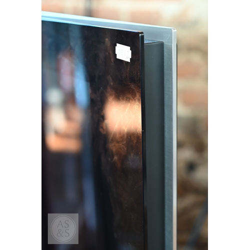 30 - A Bang & Olufsen Beovision 7 TV, 40 inch screen mounted to a B&O motorised stand, with power... 