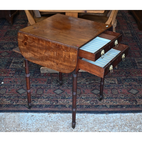 43 - A Victorian mahogany drop-leaf night table, with two drawers opposing a fall front and raised on rin... 