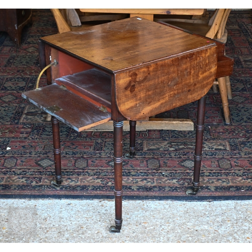 43 - A Victorian mahogany drop-leaf night table, with two drawers opposing a fall front and raised on rin... 