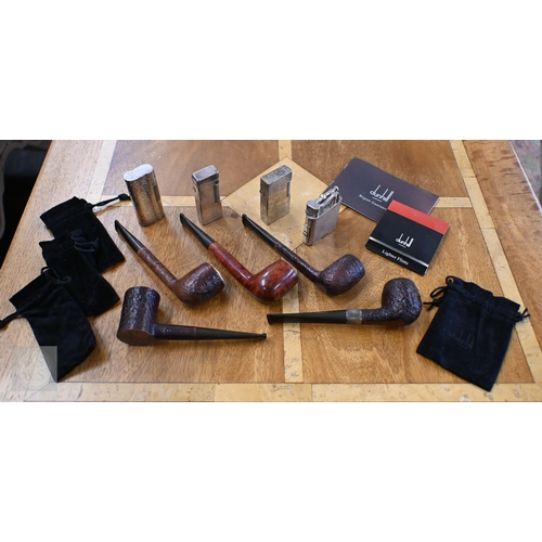 514 - Four Dunhill silver plated cigarette lighters, to/w five Dunhill pipes (one with silver band) (9)