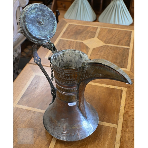 535 - A large Middle Eastern vintage copper and brass Dallah coffee pot with engraved decoration, 45 cm hi... 