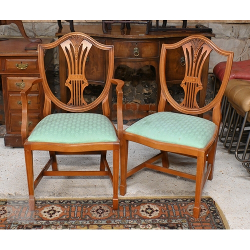 61 - # A Wade cross-banded yew veneer twin pedestal extending dining table, with two extra leaves, raised... 