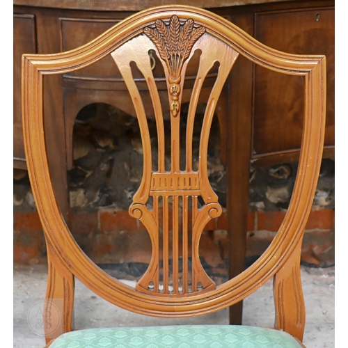61 - # A Wade cross-banded yew veneer twin pedestal extending dining table, with two extra leaves, raised... 