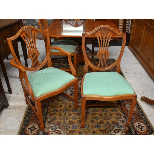 61 - # A Wade cross-banded yew veneer twin pedestal extending dining table, with two extra leaves, raised... 