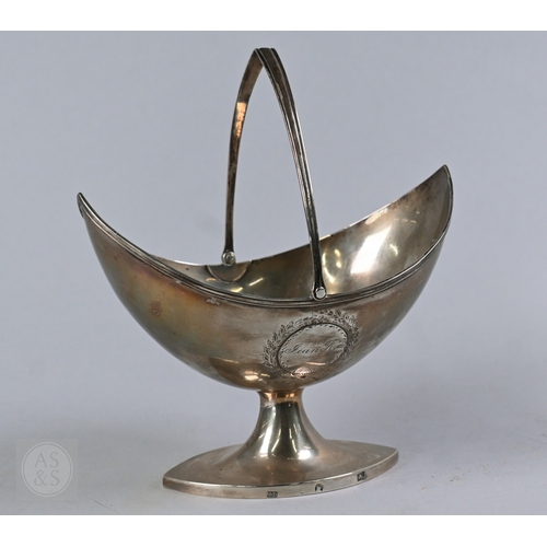 1 - A George III silver sugar basket of navette form, with swing handle and elliptical stemmed foot, mak... 