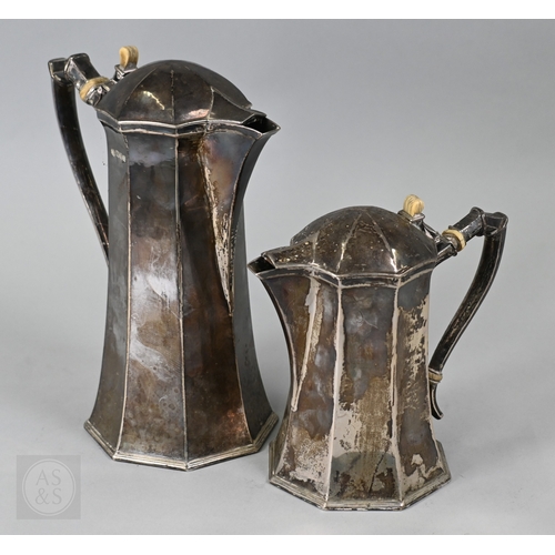 Omar Ramsden (1873-1939), a graduated pair of silver coffee pots of octagonal tapering form, with ivory thumb-pieces and insulators, engraved 'Omar Ramsden Me Fecit', London 1928, 57oz (1789g) gross