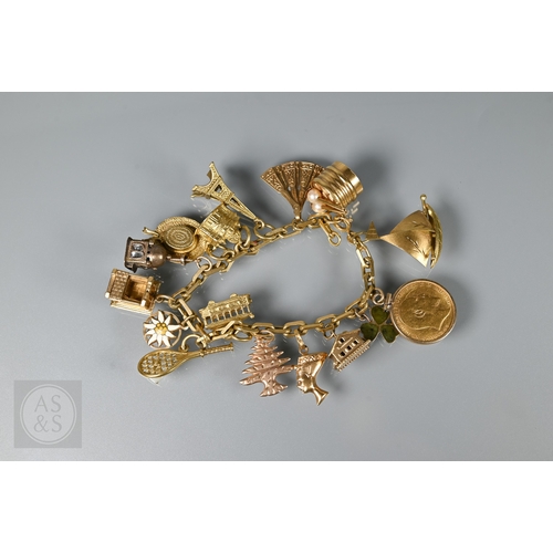125 - An 18ct yellow gold rectangular linked curb bracelet with fifteen various charms attached including ...
