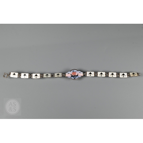 126 - A Norwegian enamel and white metal bracelet formed of eight enamelled plaques featuring Nordic scene... 