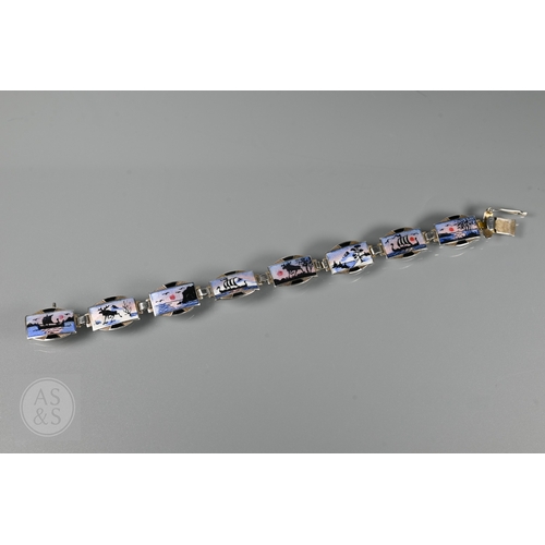 126 - A Norwegian enamel and white metal bracelet formed of eight enamelled plaques featuring Nordic scene... 