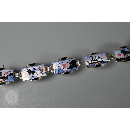 126 - A Norwegian enamel and white metal bracelet formed of eight enamelled plaques featuring Nordic scene... 