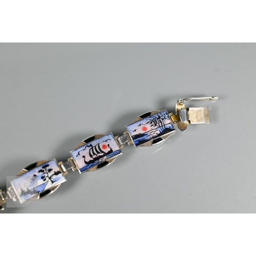 126 - A Norwegian enamel and white metal bracelet formed of eight enamelled plaques featuring Nordic scene... 