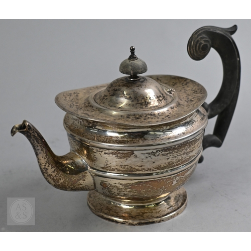 27 - An Edwardian silver three piece bachelor tea service of Empire form with composite handle and finial... 
