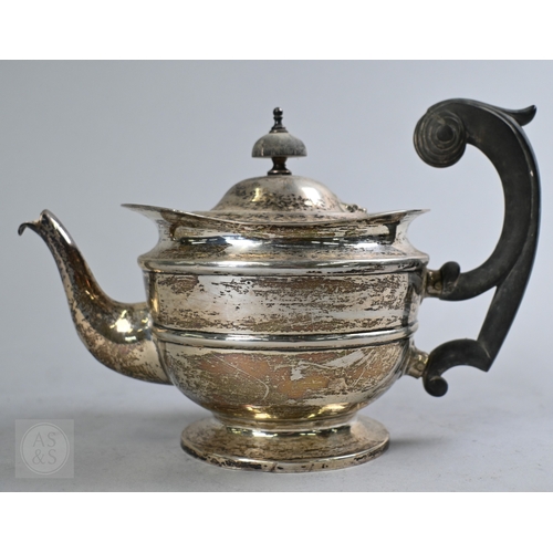 27 - An Edwardian silver three piece bachelor tea service of Empire form with composite handle and finial... 