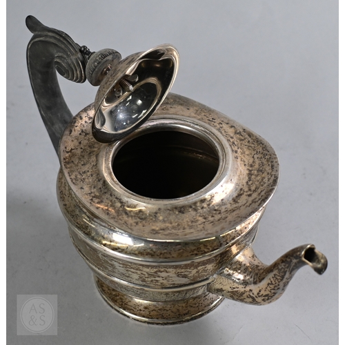 27 - An Edwardian silver three piece bachelor tea service of Empire form with composite handle and finial... 
