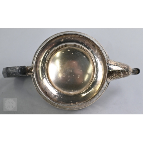 27 - An Edwardian silver three piece bachelor tea service of Empire form with composite handle and finial... 