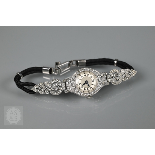 293 - An Art Deco platinum and diamond ladies cocktail watch, the Swiss MGM movement with circular Arabic ... 