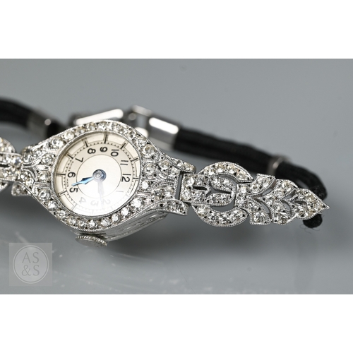 293 - An Art Deco platinum and diamond ladies cocktail watch, the Swiss MGM movement with circular Arabic ... 