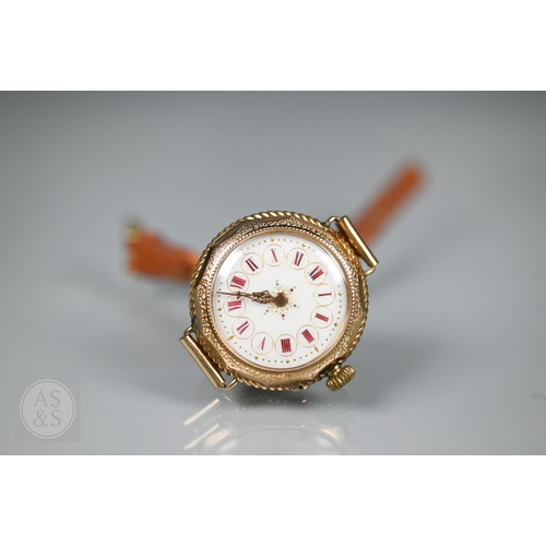295 - A vintage Swiss ladies 14K wristwatch, the white dial enamelled with Roman numerals and gilt decorat... 