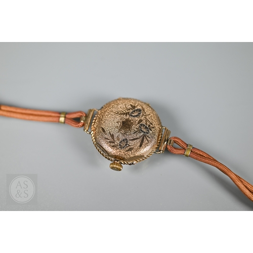 295 - A vintage Swiss ladies 14K wristwatch, the white dial enamelled with Roman numerals and gilt decorat... 