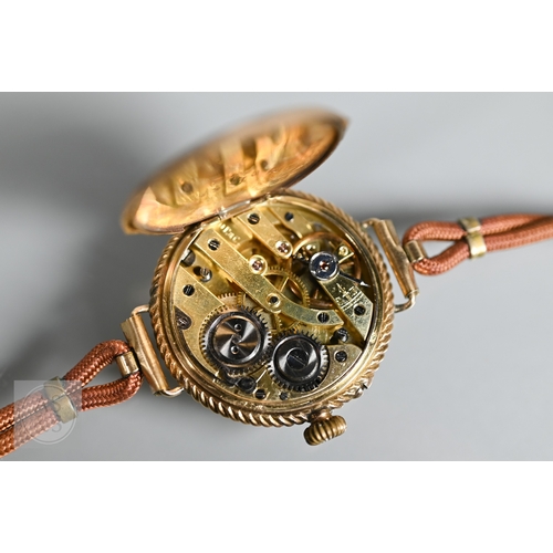 295 - A vintage Swiss ladies 14K wristwatch, the white dial enamelled with Roman numerals and gilt decorat... 