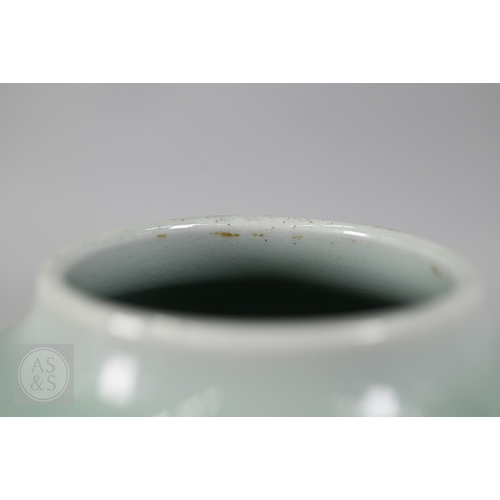 311 - An 18th century Chinese celadon jar and cover, Yueyaer guan (月牙耳罐) with gilt metal mounts, the taper... 