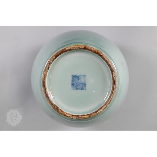 311 - An 18th century Chinese celadon jar and cover, Yueyaer guan (月牙耳罐) with gilt metal mounts, the taper... 